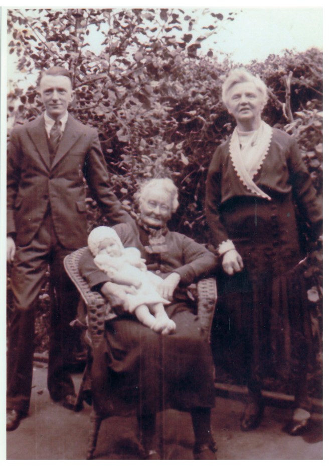 Annie Stahl seated with baby Rita, Annie Martin and her son Leo Martin